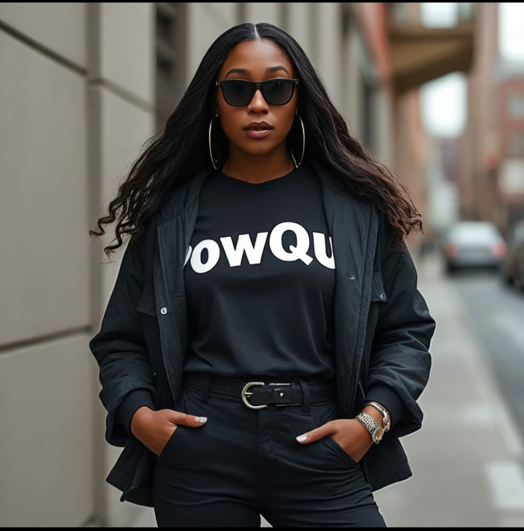 model wearing Powque Urban style black outfit on a city street