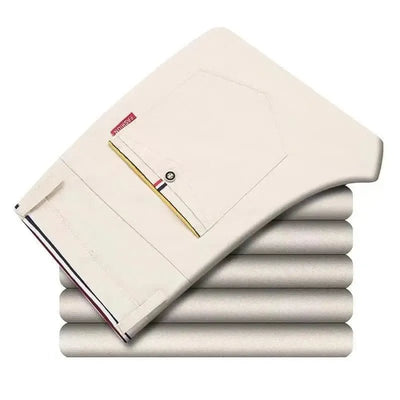 POWQUE URBAN STYLE Korean style slim fit pants men in light beige folded neatly